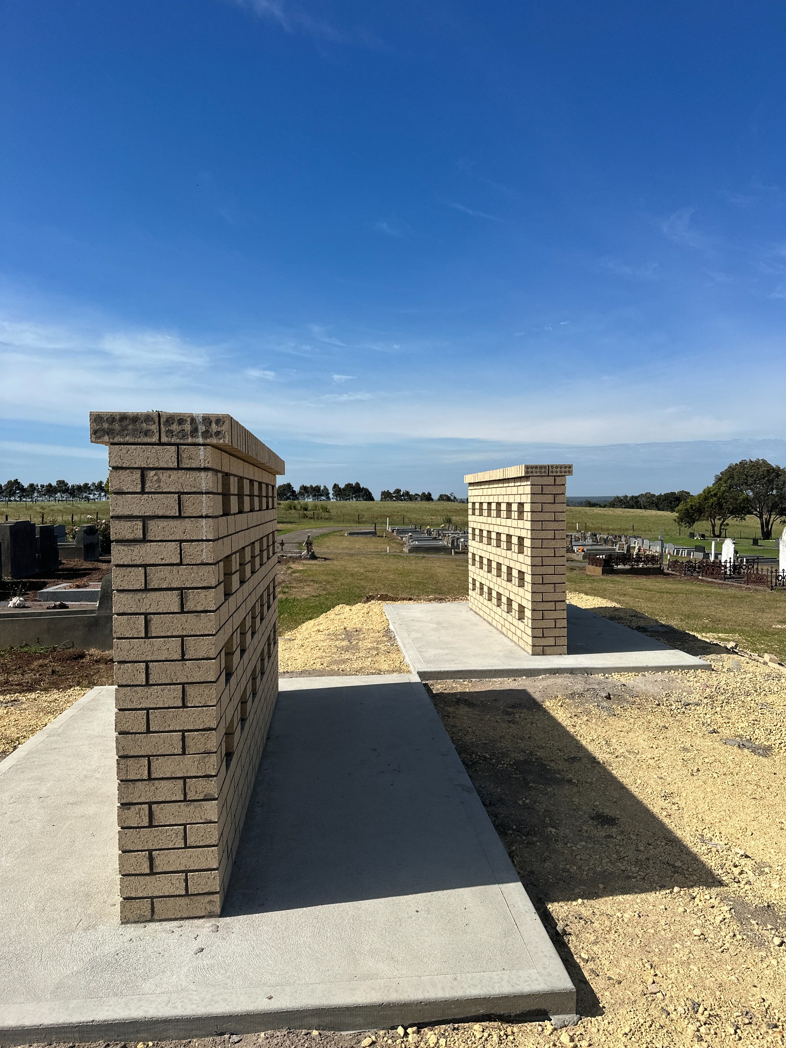Brick piers beside a concrete path